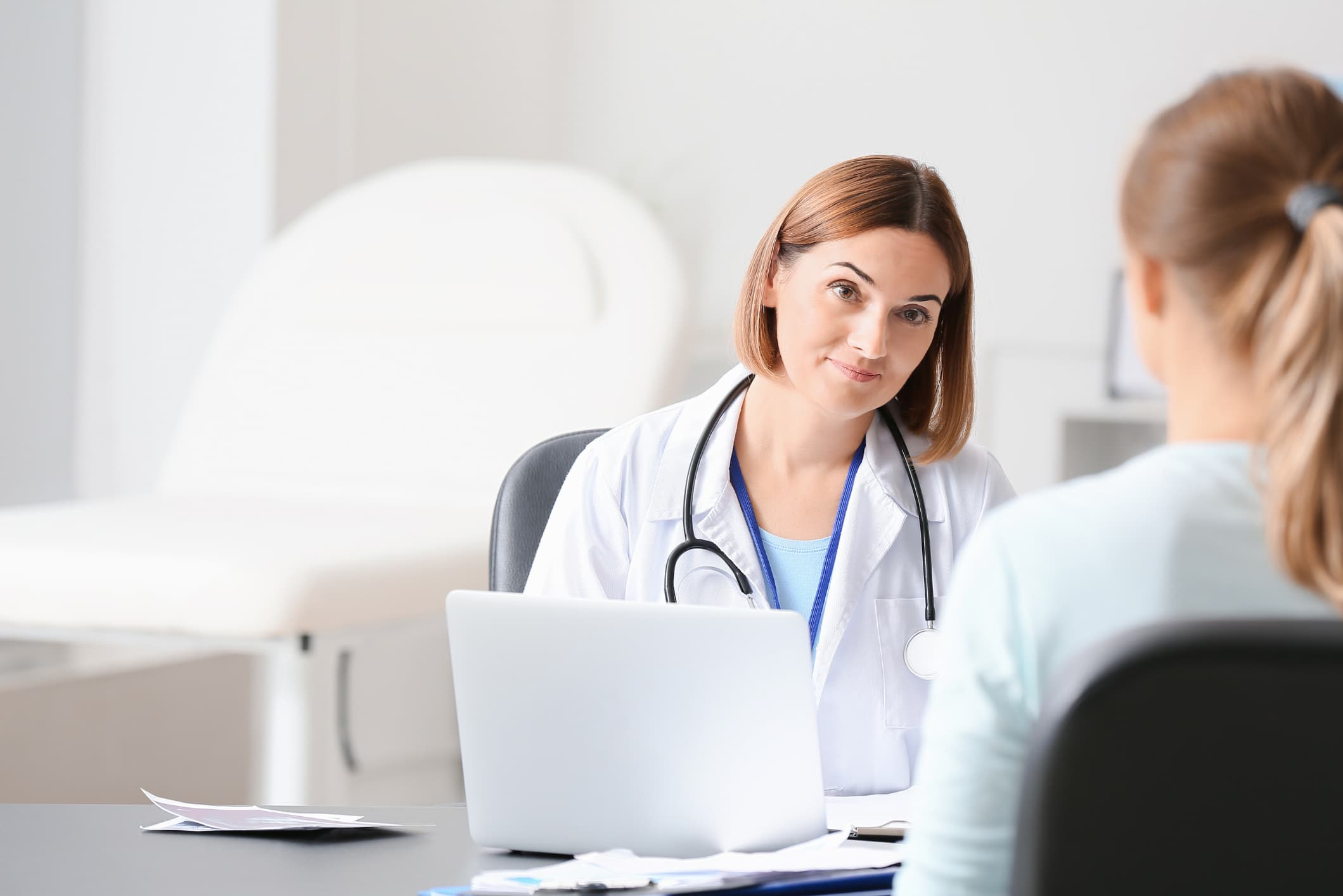 Female doctor speaking to a patient.